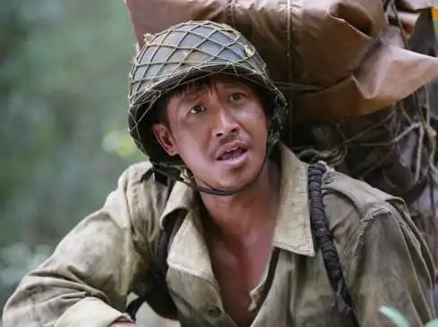 我的团长我的团中迷龙是怎么死的,他老婆的真实身份是什么
