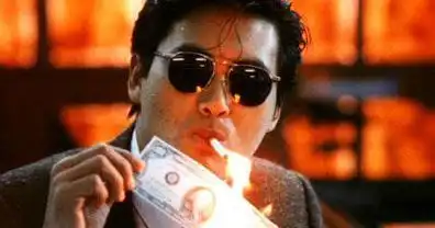 谁有英雄本色里面周润发用美元点烟的图片要gif格式的
